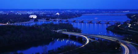 This is an aerial view of Washington, DC with the Jefferson Memorial, U.S. Capitol, Washington Monument, and Lincoln Memorial. The Potomac River runs through the center with the Key Bridge at right .の写真素材