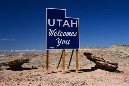 This is a road sign that says Utah welcomes you.の写真素材