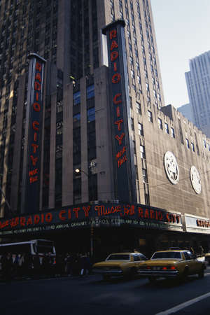 This is the exterior of Radio City Music Hall where the famous Rockettes perform. It shows the red neon lights on the outside.のeditorial素材