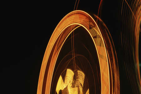 Amusement park ride in eveningの写真素材