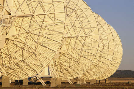 Row of VLA Very Large Array radio telescope dishesの写真素材