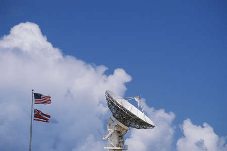 VLA Very Large Array radio telescope dish with flagsの写真素材