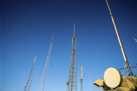 TV/radio antenna pointing into skyの写真素材