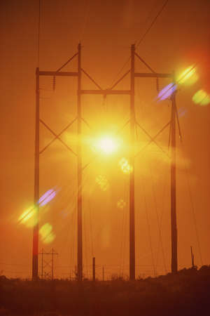 Power lines with sunburstの写真素材