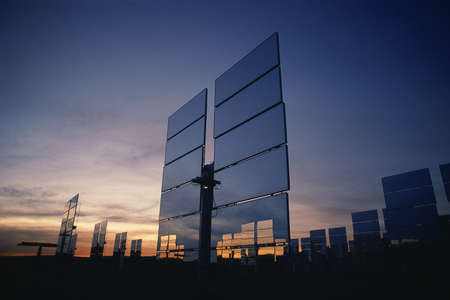 Upright solar panels at duskの写真素材