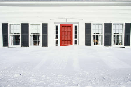 Home with snow up to windowsの写真素材