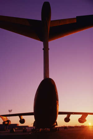 Rear view of airplane on tarmacの写真素材
