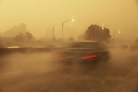 Cars on foggy highwayの写真素材