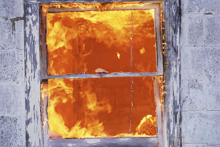 Fire seen through building window