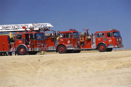 Three fire engines parked side-by-side