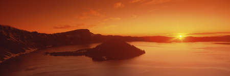 Sun rising over Crater Lake National Park, Oregonの写真素材