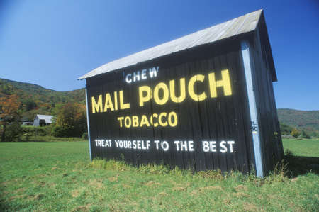 A sign that reads ÒChew Mail Pouch Tobacco - Treat Yourself to the BestÓのeditorial素材