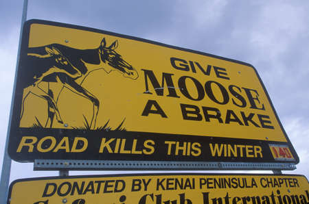 A sign that reads ÒGive moose a brakeÓのeditorial素材