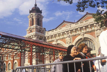 Tourists waiting in line to visit Ellis Island National Park, New York City, New Yorkのeditorial素材