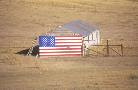 American Flag Hung on an Old Barn, Wyomingのeditorial素材