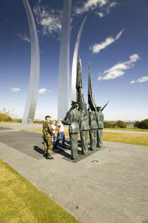 Military family look at Bronze Honor Guard and three soaring spires of the Air Force Memorial, Arlington, Virginia in Washington D.C. areaのeditorial素材