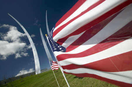American flags fly into the lens at the Air Force Memorial at One Air Force Memorial Drive, Arlington, Virginia in Washington D.C. areaのeditorial素材