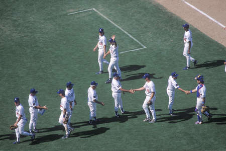 Overhead view of baseball players greeting each other on diamond, Dodger Stadium, Los Angeles, CAのeditorial素材