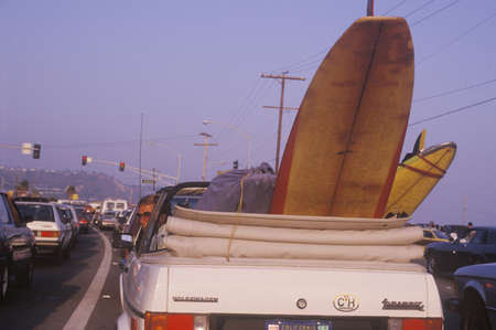 Surfboard in back of convertible, Sunset Beach, Malibu, CAのeditorial素材