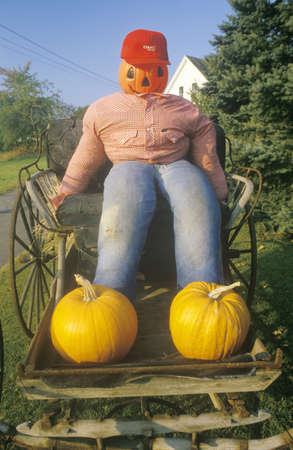 Halloween Pumpkin Character Sitting in Wagon, New Englandのeditorial素材