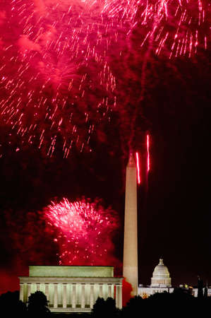 Fourth of July celebration with fireworks exploding over the Lincoln Memorial, Washington Monument and U.S. Capitol, Washington D.C.のeditorial素材
