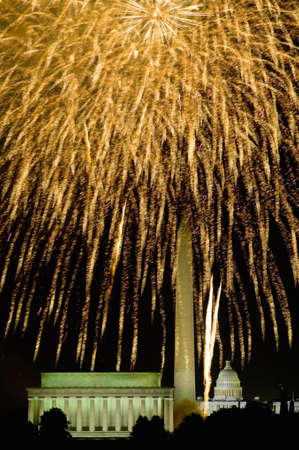 Fourth of July celebration with fireworks exploding over the Lincoln Memorial, Washington Monument and U.S. Capitol, Washington D.C.のeditorial素材