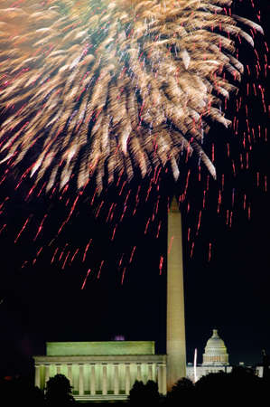 Fourth of July celebration with fireworks exploding over the Lincoln Memorial, Washington Monument and U.S. Capitol, Washington D.C.のeditorial素材