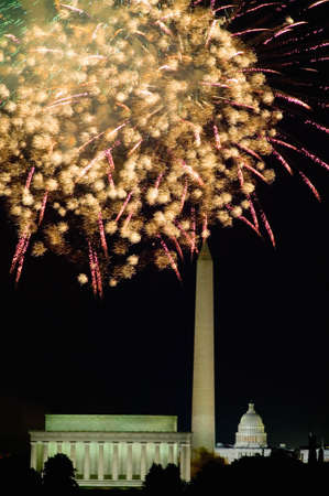 Fourth of July celebration with fireworks exploding over the Lincoln Memorial, Washington Monument and U.S. Capitol, Washington D.C.のeditorial素材