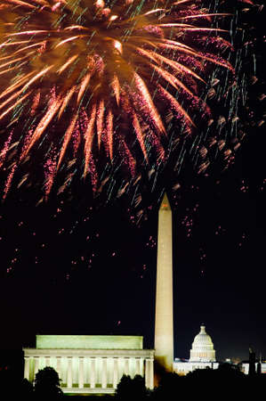 Fourth of July celebration with fireworks exploding over the Lincoln Memorial, Washington Monument and U.S. Capitol, Washington D.C.のeditorial素材
