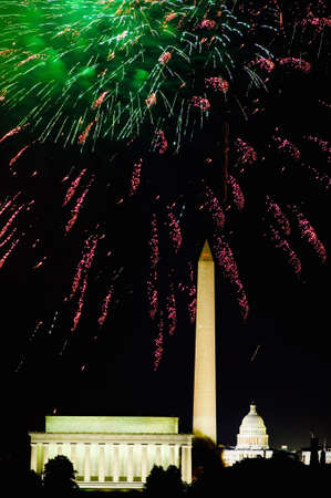 Fourth of July celebration with fireworks exploding over the Lincoln Memorial, Washington Monument and U.S. Capitol, Washington D.C.のeditorial素材