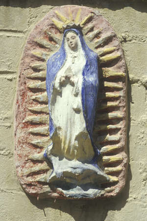 A statue of Virgin Mary is found in a 1771 San Gabriel Mission Museum in Californiaのeditorial素材