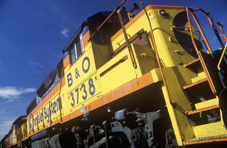 The sun catches the bright yellow of a B&O Railroad engine, Minneapolis Railroadのeditorial素材