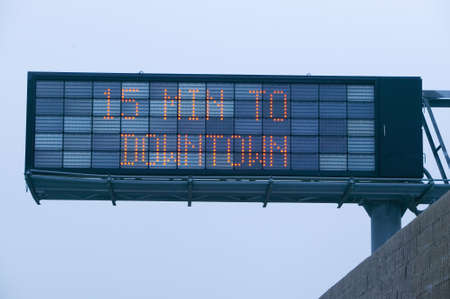 "LED highway sign displays ""15 minutes to downtown"" showing how much traffic on Highway 101, Los Angeles, California"のeditorial素材