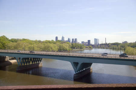 View of Schuylkill River and Philadelphia skyline from moving Amtrak train, Philadelphia, Pennsylvaniaのeditorial素材