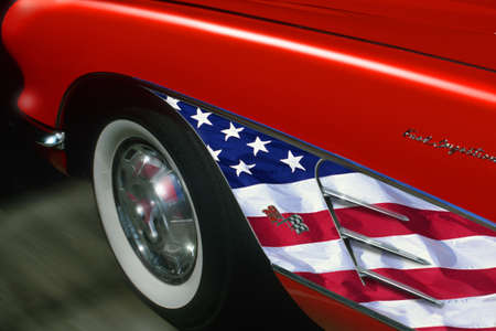 Red sports car with American flag trim