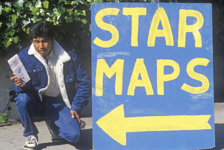 Man sells ÒStar MapsÓ on a Hollywood street, Los Angeles, Californiaのeditorial素材