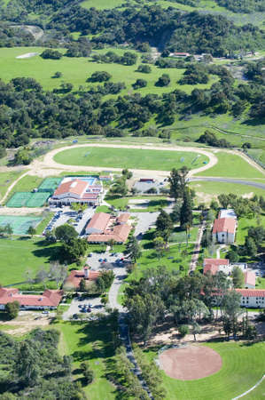 Springtime aerial view of Villanova Prep school with track, pool, baseball diamond, tennis courts...