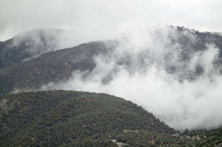 Stormy clouds come over a mountain in Kern County's, Pine Mountain Club, near Bakersfield, Californiaのeditorial素材