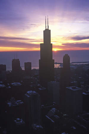 John Hancock Building towers above Chicago Skyline at Sunrise, Chicago, Illinoisのeditorial素材