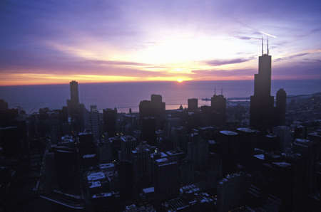 John Hancock Building towers above Chicago Skyline at Sunrise, Chicago, Illinoisのeditorial素材