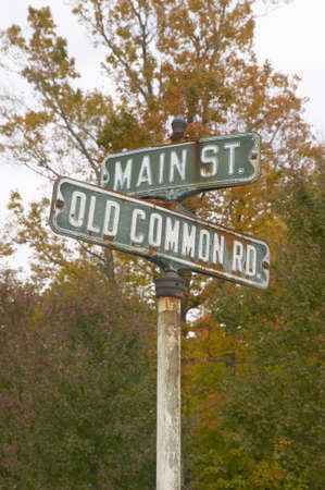 Main Street USA and Old Common Road sign in autumn, western Massachusetts, New Englandのeditorial素材