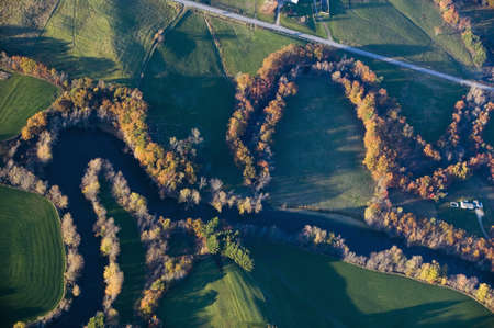 Aerial view of river and autumn trees near Augusta, Maineのeditorial素材