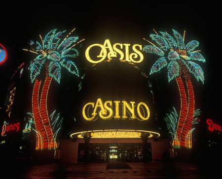 Neon lights outside of Oasis Casino and Hotel at night, Las Vegas, NVのeditorial素材
