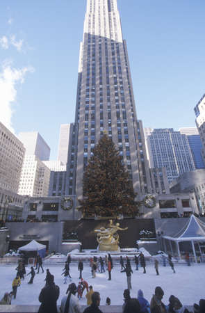 Rockefeller Square with snowy ice skating rink and Christmas tree in mid-town Manhattan, NYのeditorial素材