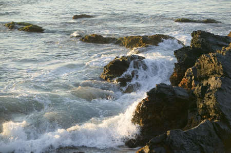 Wave breaks at the Cliff Walk, Cliffside Mansions of Newport Rhode Islandのeditorial素材