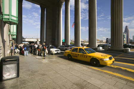 Exterior view of yellow taxi cab in front of the  30th Street Station, a national Register of Historic Places, AMTRAK Train Station in Philadelphia, PAのeditorial素材
