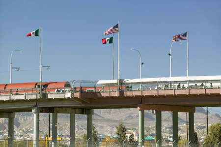 International border of Mexico & the United States, with flags and walking bridge connecting El Paso Texas to Juarez, Mexicoのeditorial素材