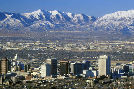 Skyline of Salt Lake City, UT with Snow capped Wasatch Mountains in backgroundのeditorial素材