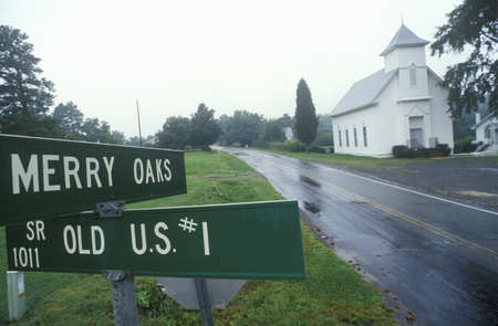 Route 1 in rain with church in background, VAのeditorial素材