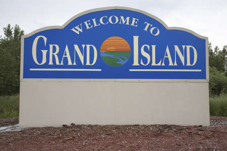 Sign that reads Welcome to Grand Island, Grand Island, Nebraskaのeditorial素材